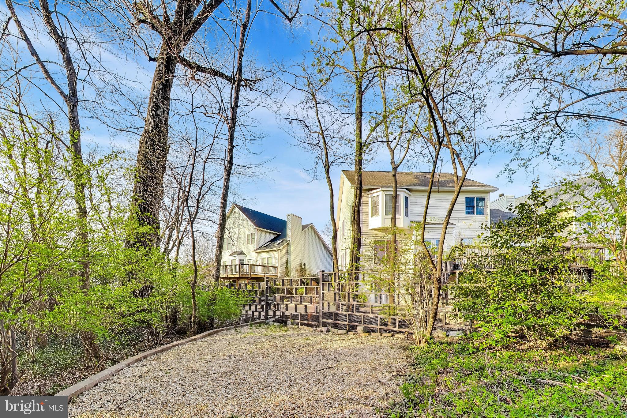 9200 Linden Grove Court Silver Spring, MD 20910 - Photo 67 of 72 front view of a house with a yard and potted plants