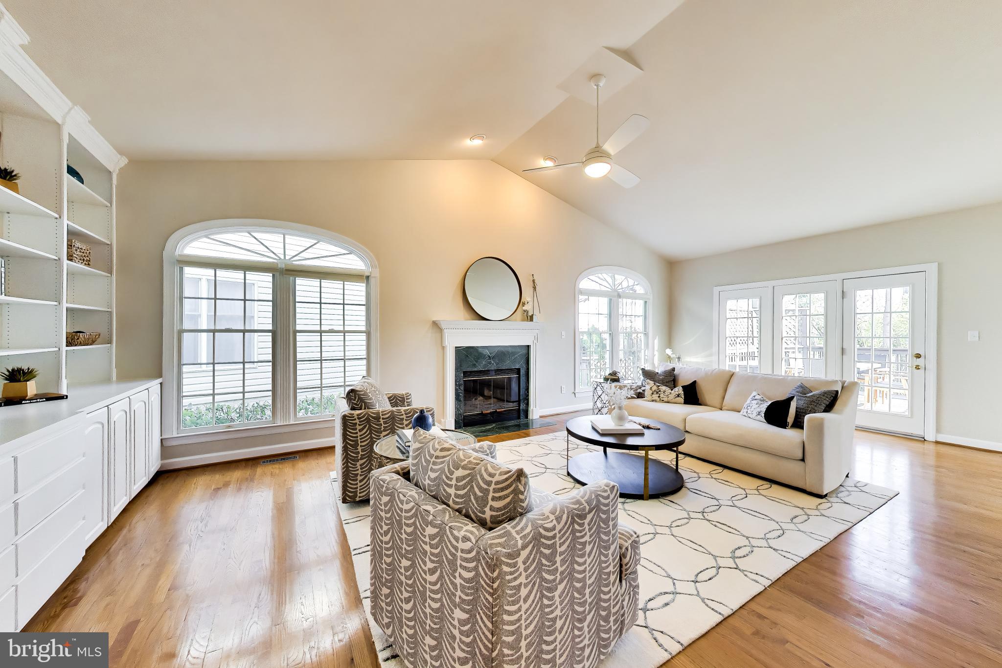 9200 Linden Grove Court Silver Spring, MD 20910 - Photo 10 of 72 a living room with fireplace furniture and a large window