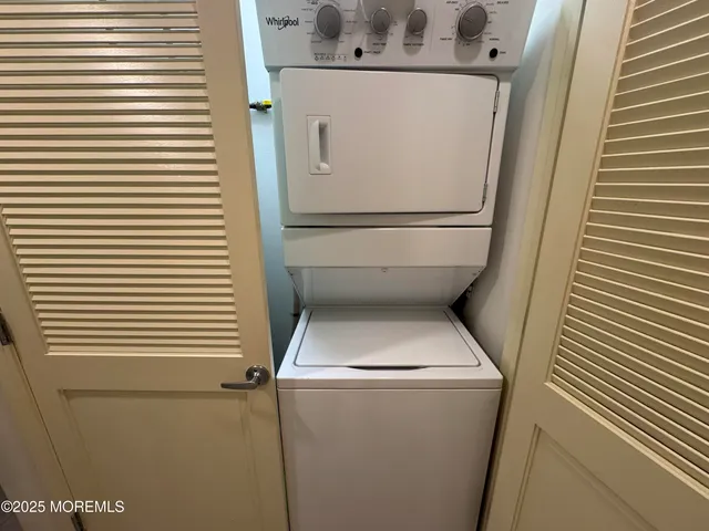 a bedroom with a bed and flat screen tv