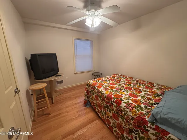 a bedroom with a bed and a table