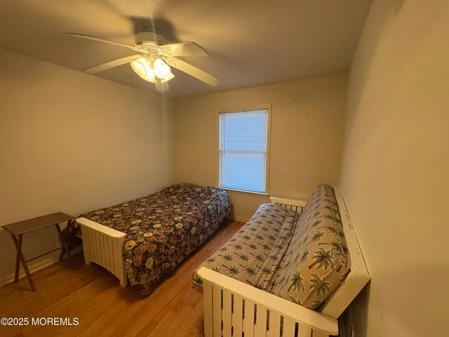 a bedroom with bed and a window