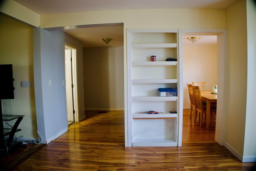 96 Harris Street Methuen, MA 01844 - Photo 11 of 19 a view of kitchen with cabinets and wooden floor