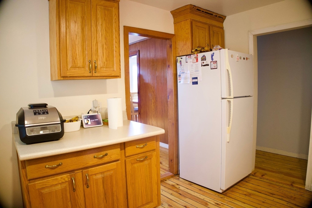 96 Harris Street Methuen, MA 01844 - Photo 13 of 19 a white refrigerator freezer sitting inside of a kitchen