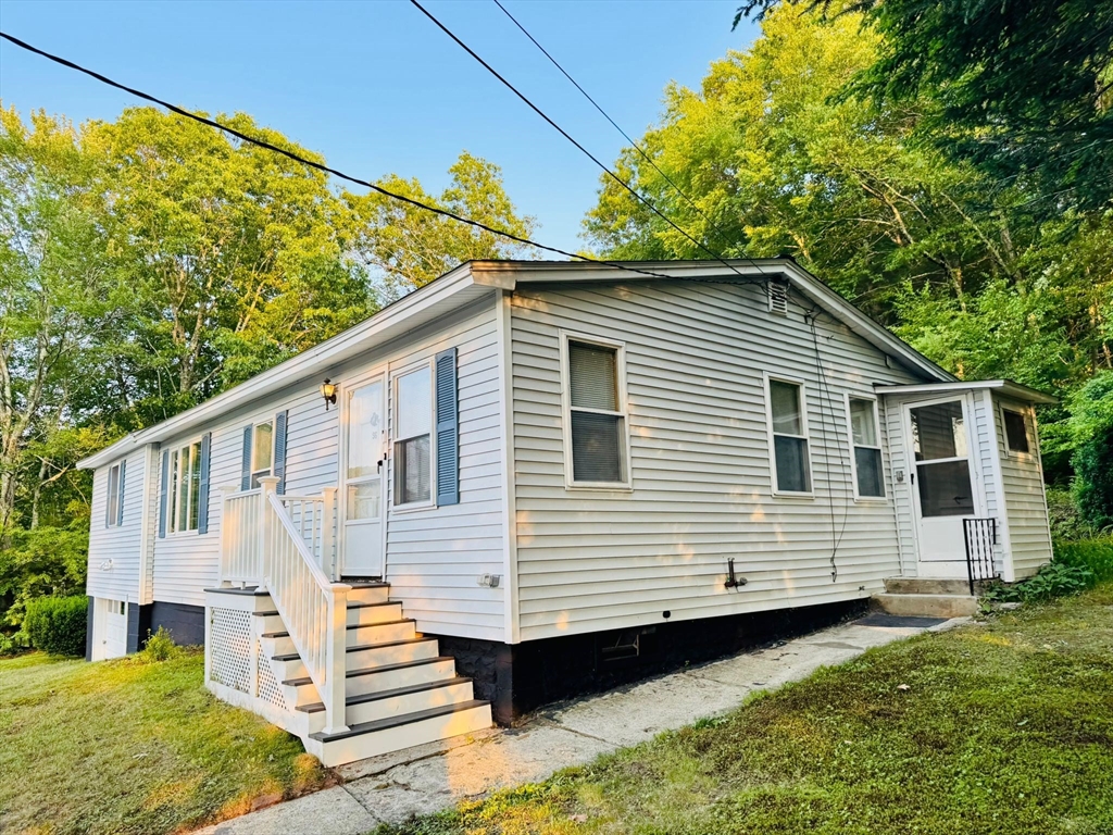 96 Harris Street Methuen, MA 01844 - Photo 3 of 19 a view of a white house with a large window