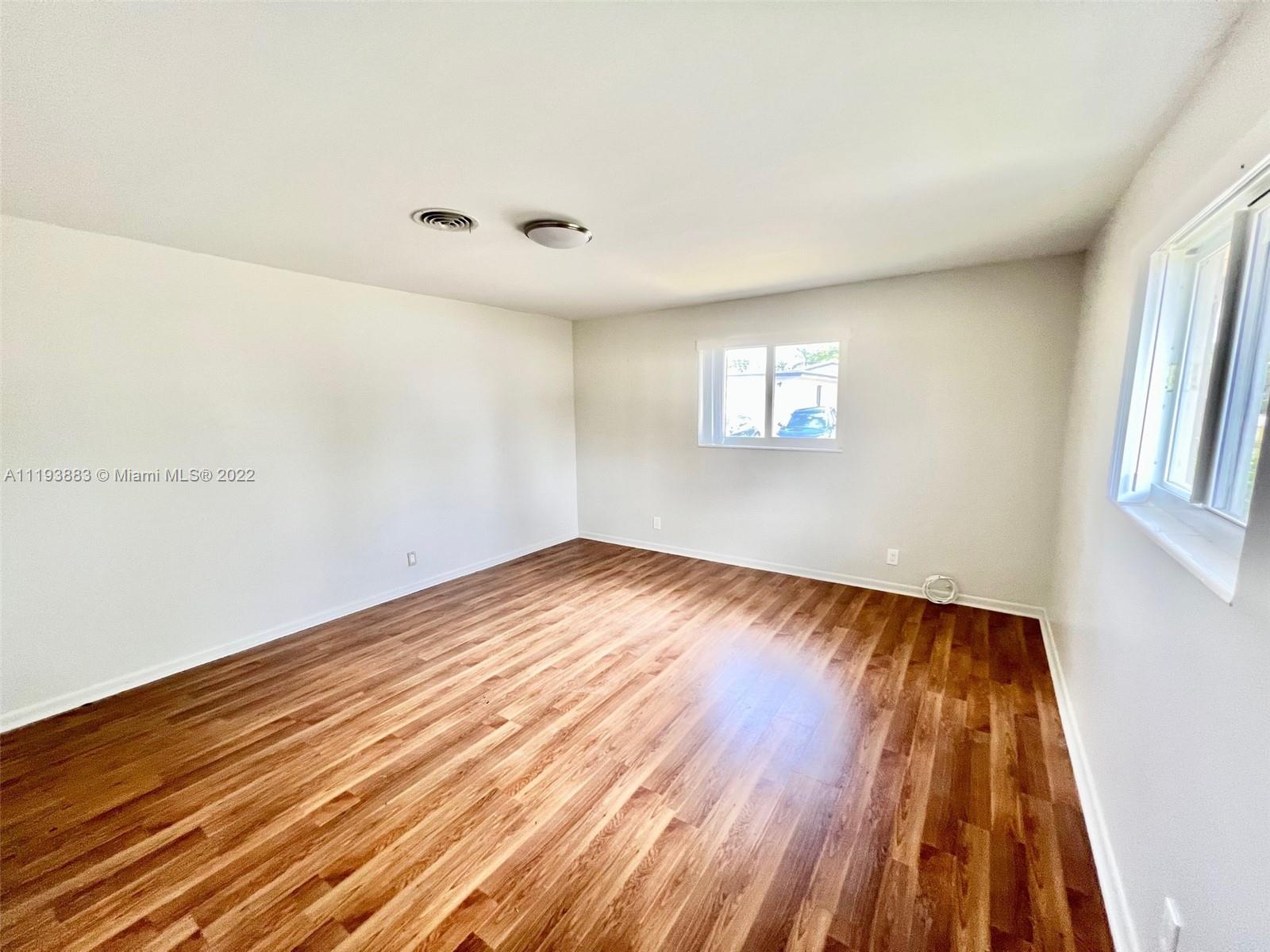 4407 Arthur Street Hollywood, FL 33021 - Photo 16 of 25 a view of empty room with wooden floor