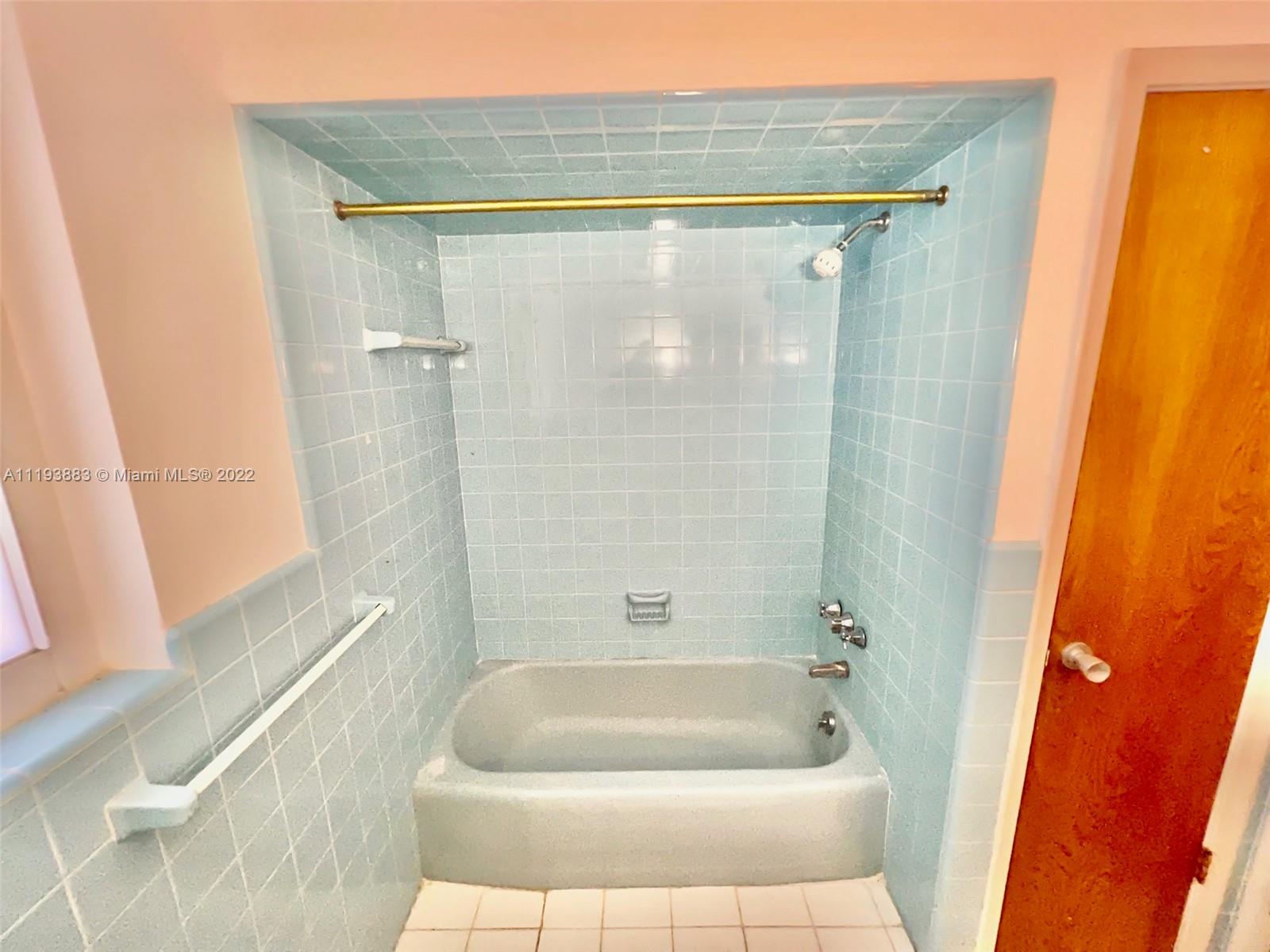 4407 Arthur Street Hollywood, FL 33021 - Photo 18 of 25 a bathroom with a bathtub and shower