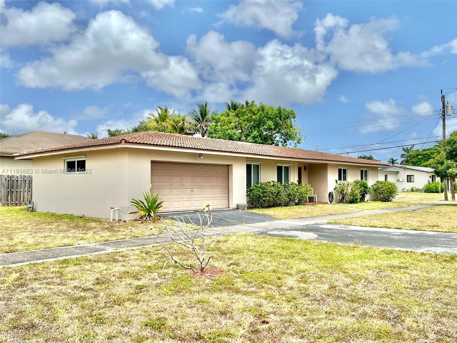 4407 Arthur Street Hollywood, FL 33021 - Photo 21 of 25 a view of a house with a yard