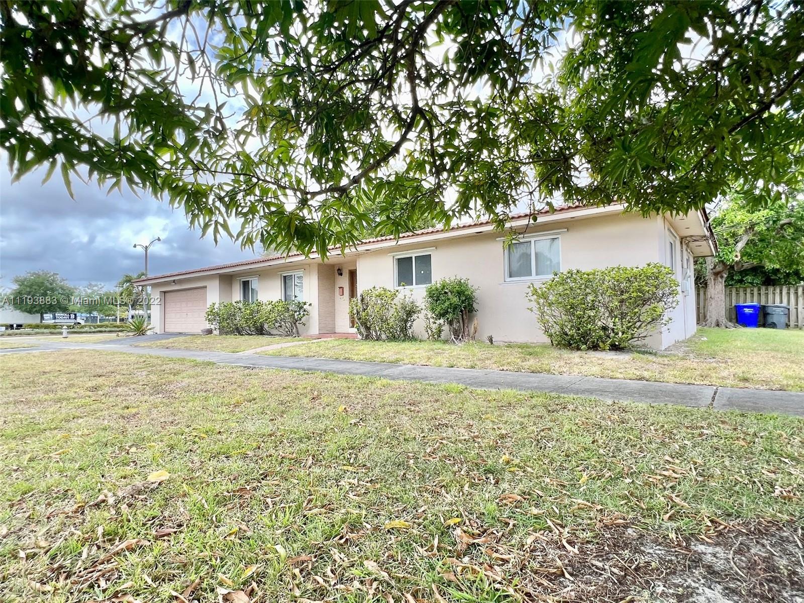 4407 Arthur Street Hollywood, FL 33021 - Photo 22 of 25 a front view of a house with garden