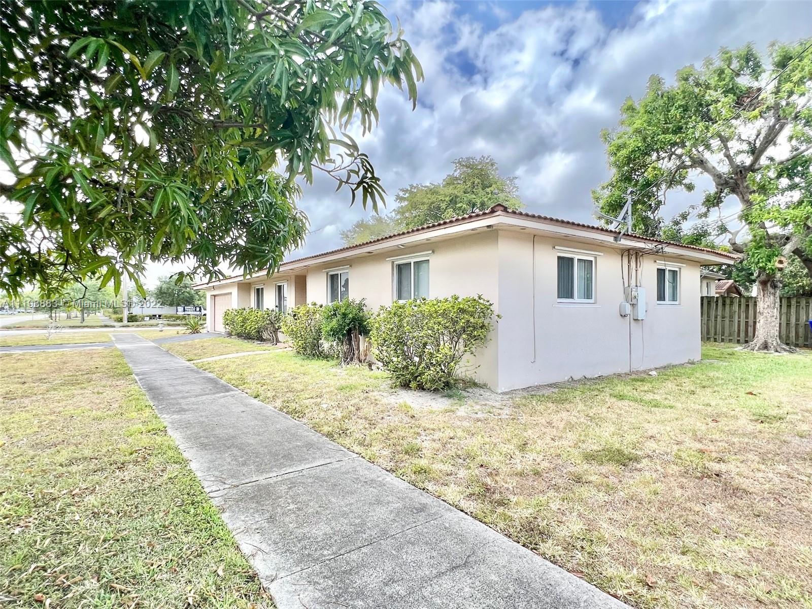 4407 Arthur Street Hollywood, FL 33021 - Photo 23 of 25 a view of a house with backyard and a tree