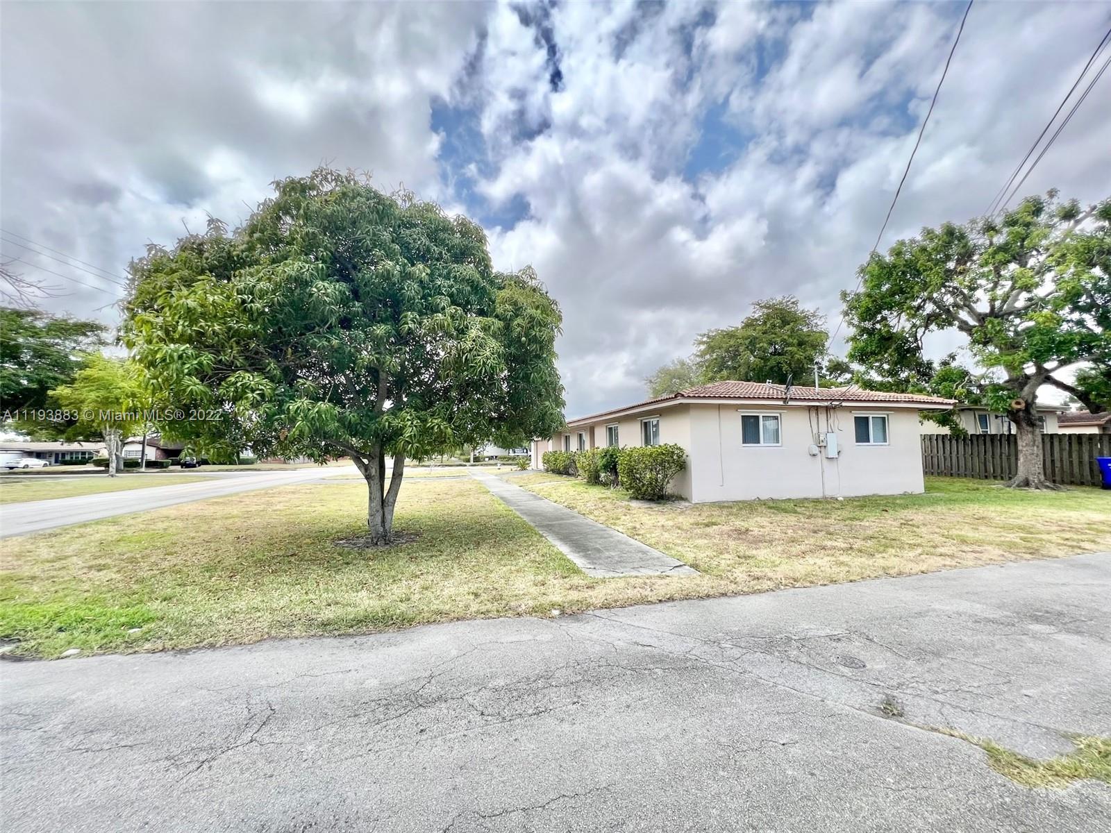 4407 Arthur Street Hollywood, FL 33021 - Photo 24 of 25 a view of a house with a yard