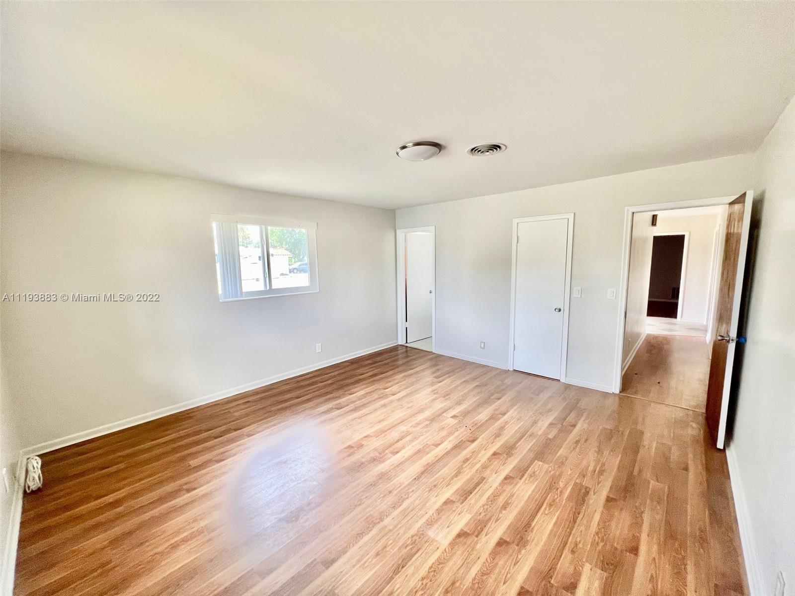 4407 Arthur Street Hollywood, FL 33021 - Photo 7 of 25 a view of empty room with wooden floor and fan