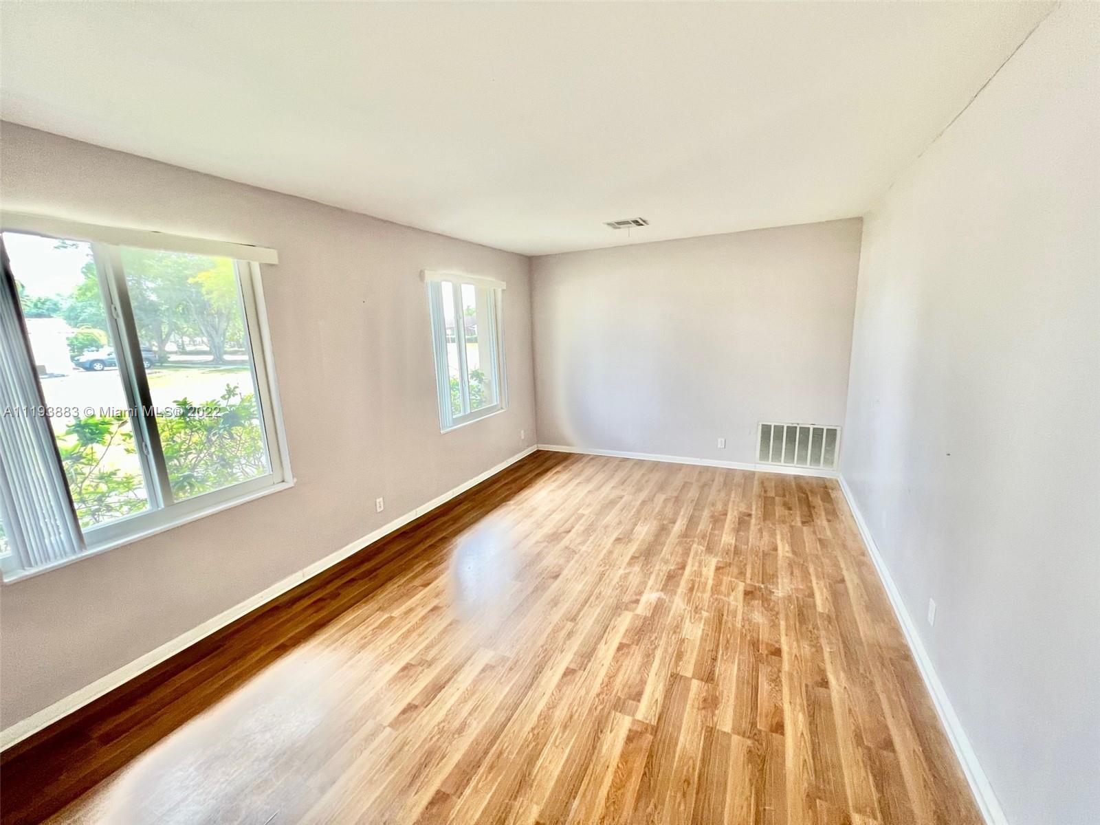 4407 Arthur Street Hollywood, FL 33021 - Photo 9 of 25 a view of empty room with wooden floor and fan