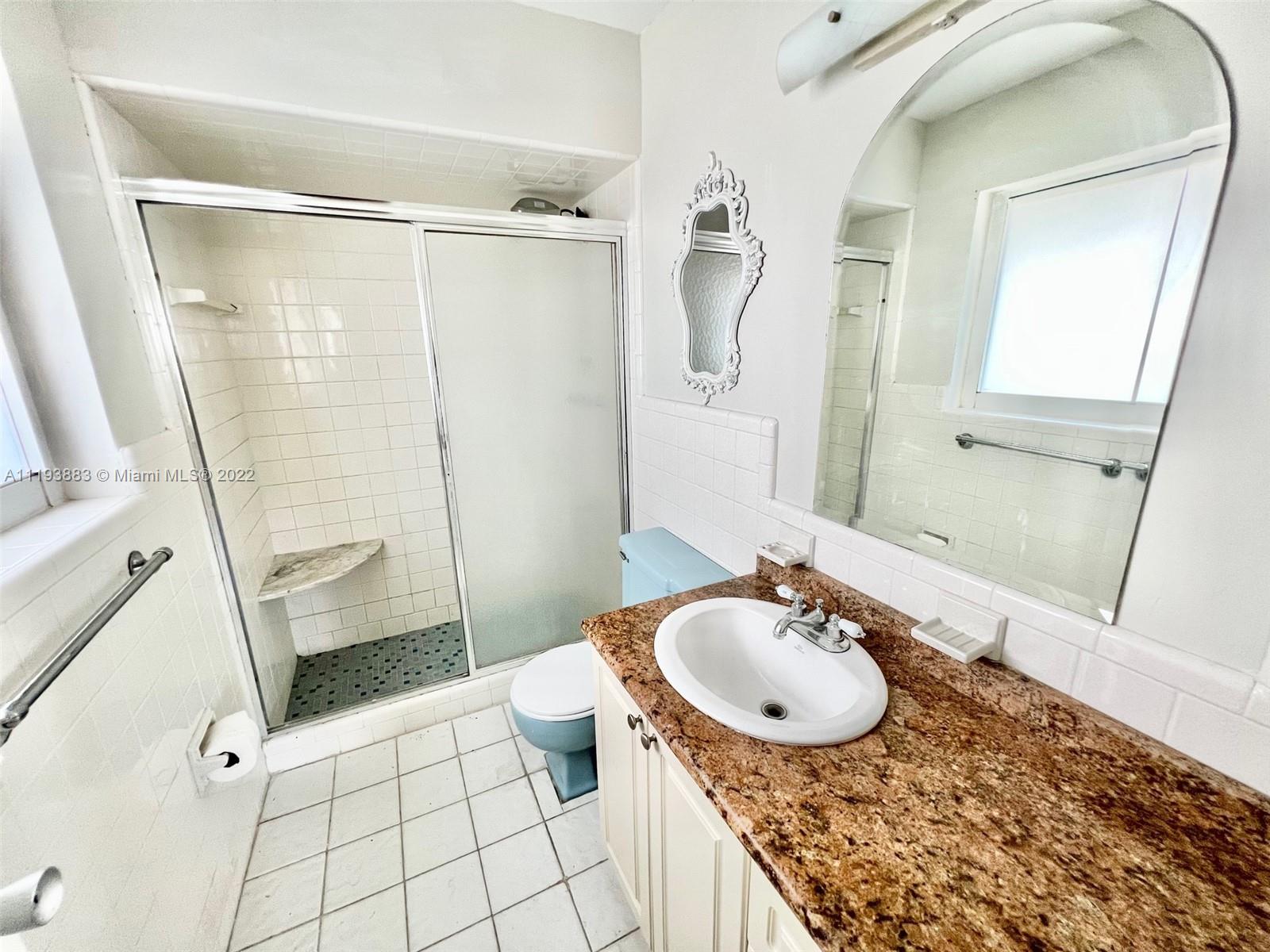 4407 Arthur Street Hollywood, FL 33021 - Photo 10 of 25 a bathroom with a sink a toilet and shower