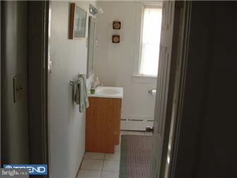 1806 44th Street Pennsauken, NJ 08110 - Photo 11 of 12 a bathroom with a sink and mirror