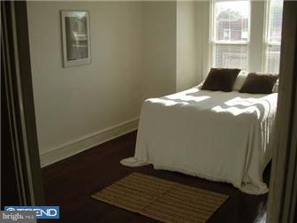 1806 44th Street Pennsauken, NJ 08110 - Photo 9 of 12 a bedroom with a bed and a window
