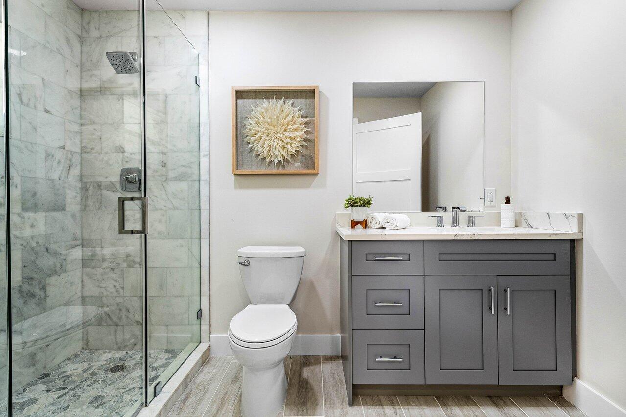 5497 North Ocean Boulevard Ocean Ridge, FL 33435 - Photo 18 of 33 a bathroom with a toilet a sink and shower