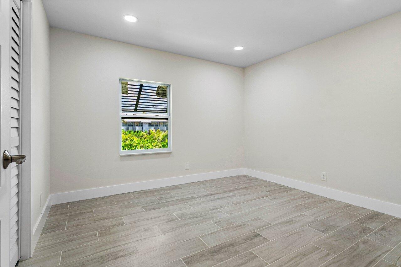 5497 North Ocean Boulevard Ocean Ridge, FL 33435 - Photo 21 of 33 a view of room with window and wooden floor