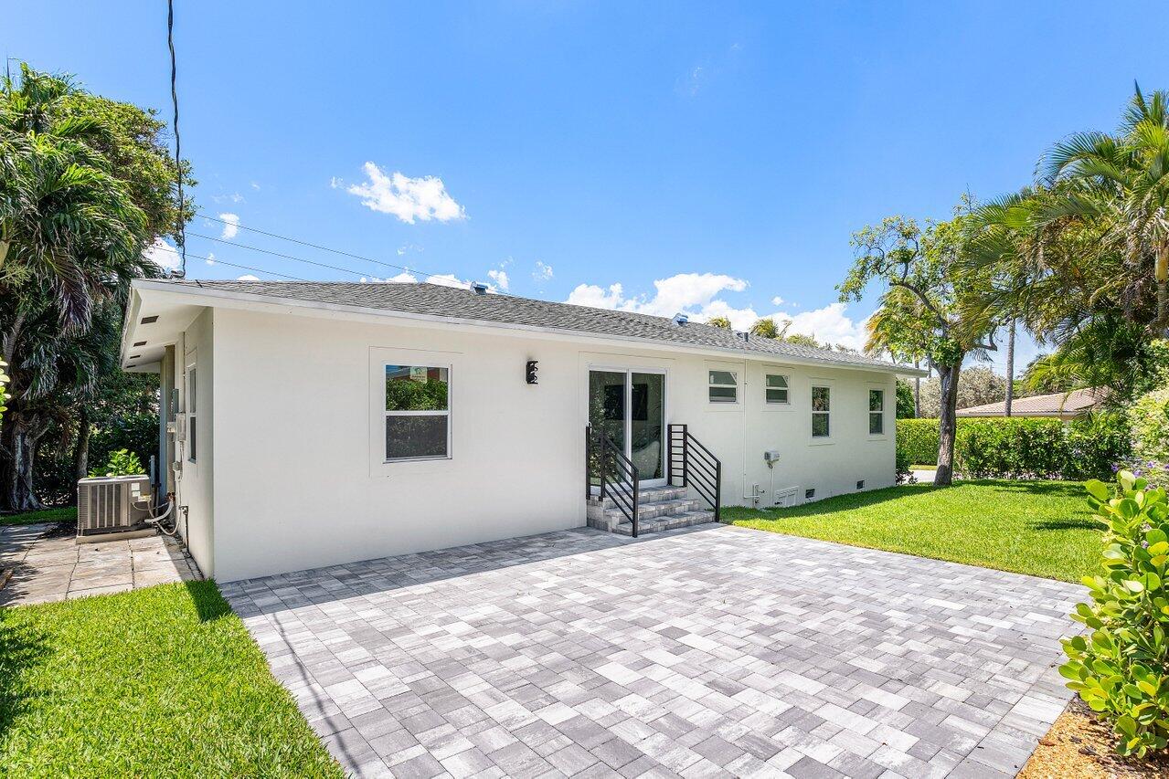 5497 North Ocean Boulevard Ocean Ridge, FL 33435 - Photo 25 of 33 a front view of a house with garden