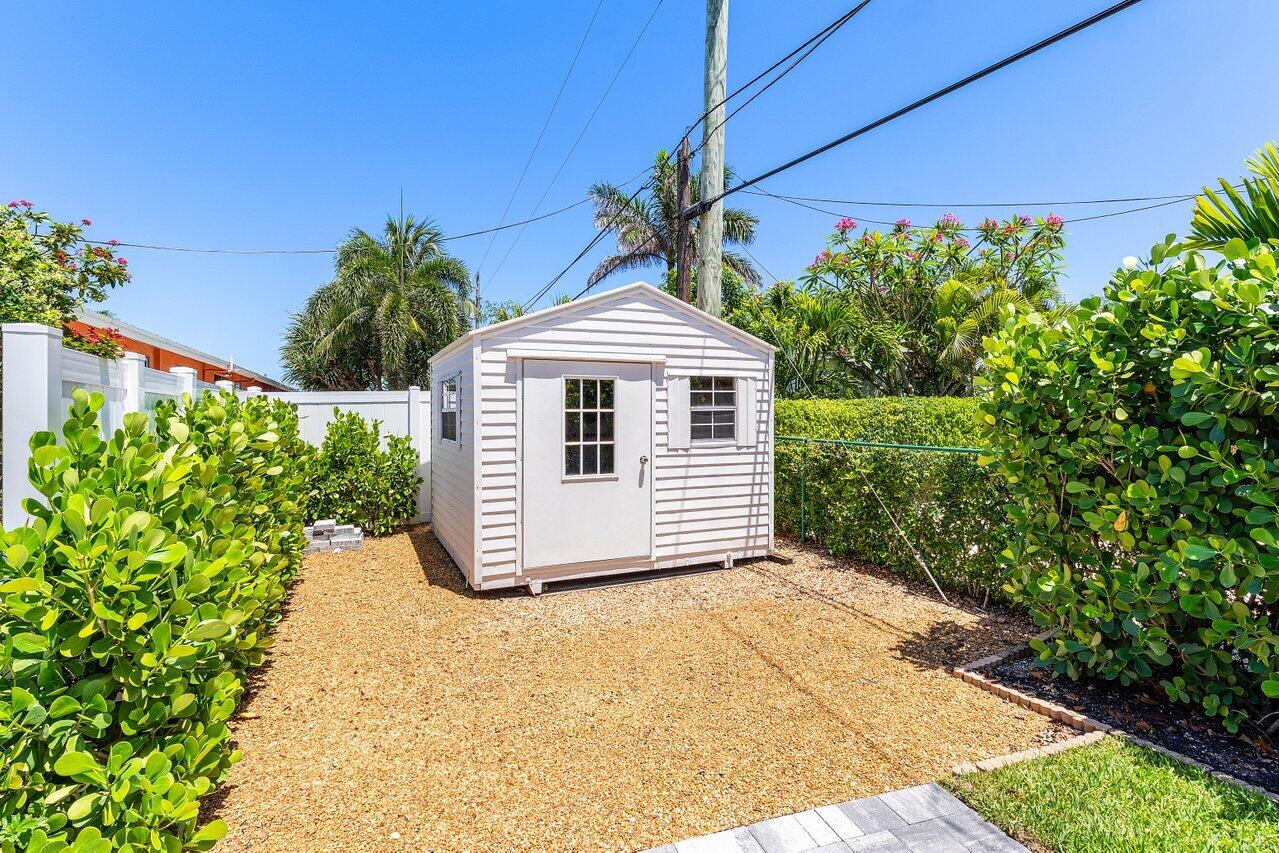 5497 North Ocean Boulevard Ocean Ridge, FL 33435 - Photo 27 of 33 a front view of a house with a yard