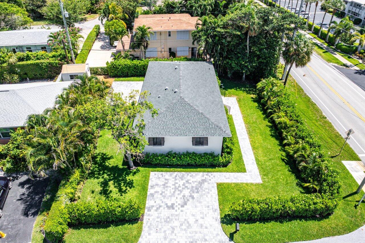 5497 North Ocean Boulevard Ocean Ridge, FL 33435 - Photo 30 of 33 a aerial view of a house with a yard and potted plants