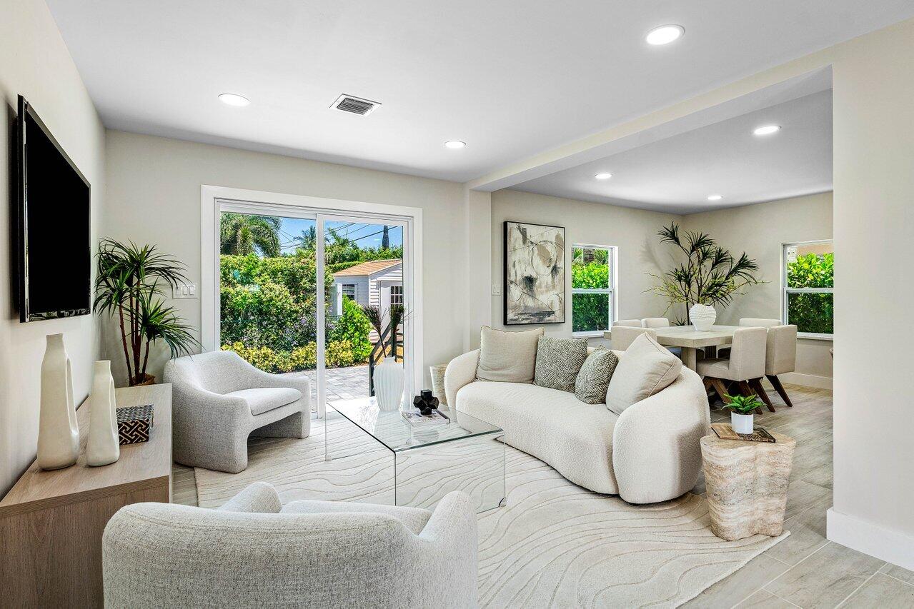 5497 North Ocean Boulevard Ocean Ridge, FL 33435 - Photo 5 of 33 a living room with furniture and a flat screen tv