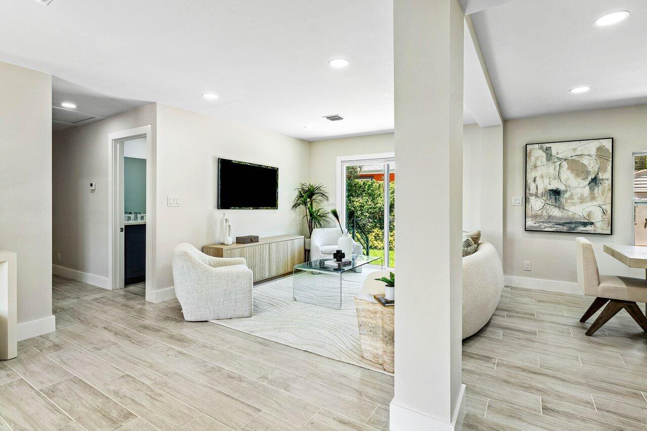 5497 North Ocean Boulevard Ocean Ridge, FL 33435 - Photo 8 of 33 a living room with furniture and a flat screen tv