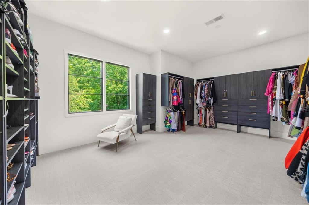 494 River Overlook Road Dawsonville, GA 30534 - Photo 46 of 96 a view of game room with windows and closet