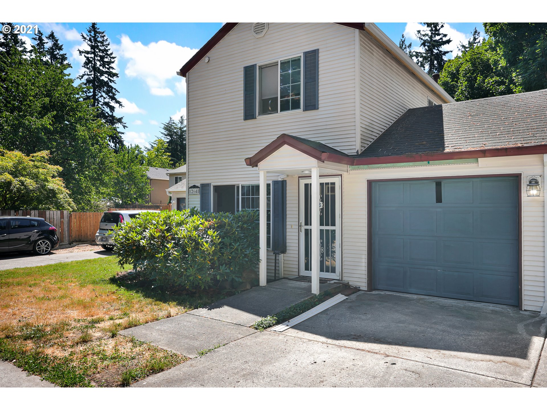 12648 Southeast Foster Road, Unit 10B Portland, OR 97236 - Photo 1 of 22 a house view with a garden space