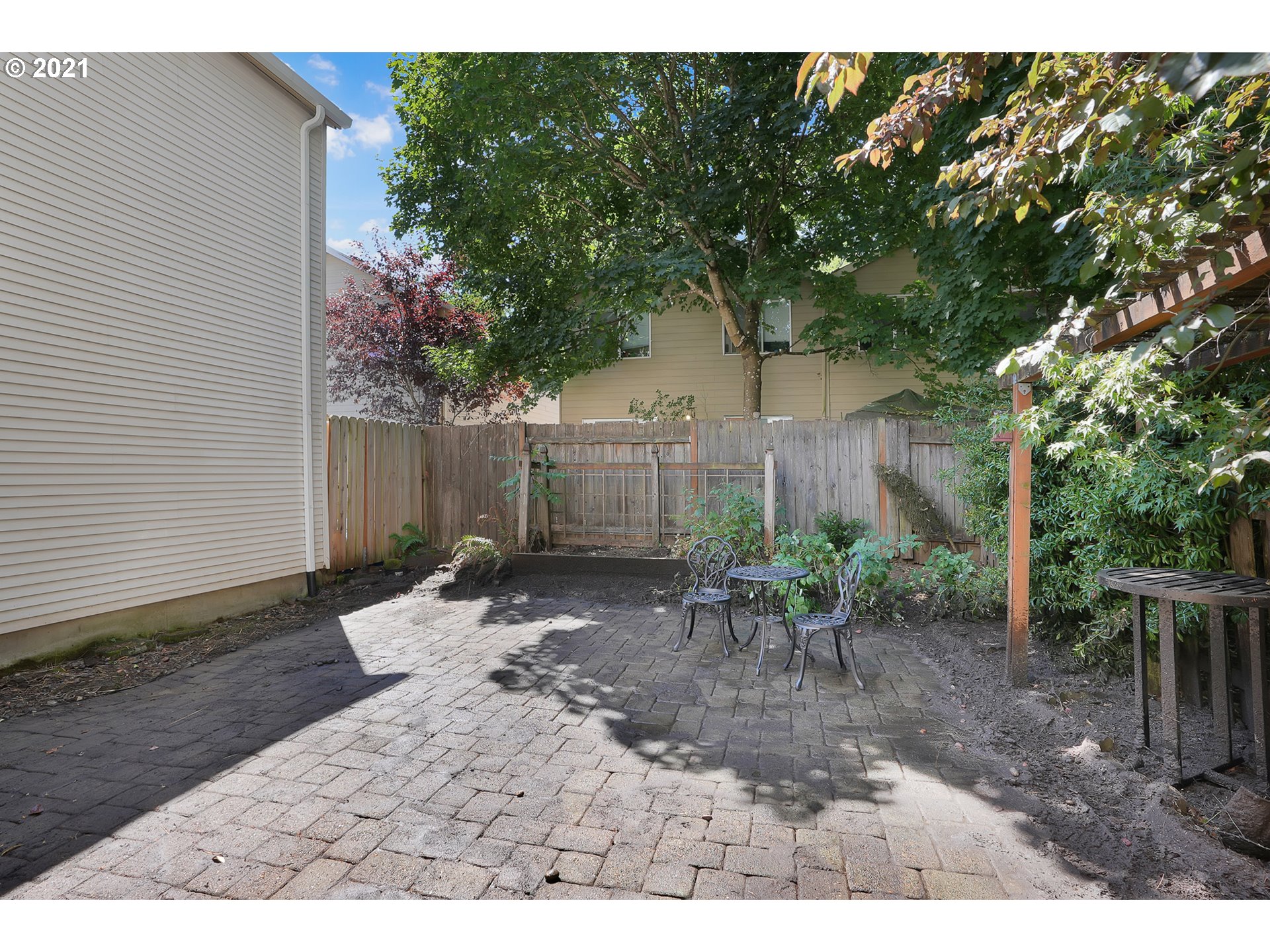 12648 Southeast Foster Road, Unit 10B Portland, OR 97236 - Photo 15 of 22 a view of a table and chairs in backyard