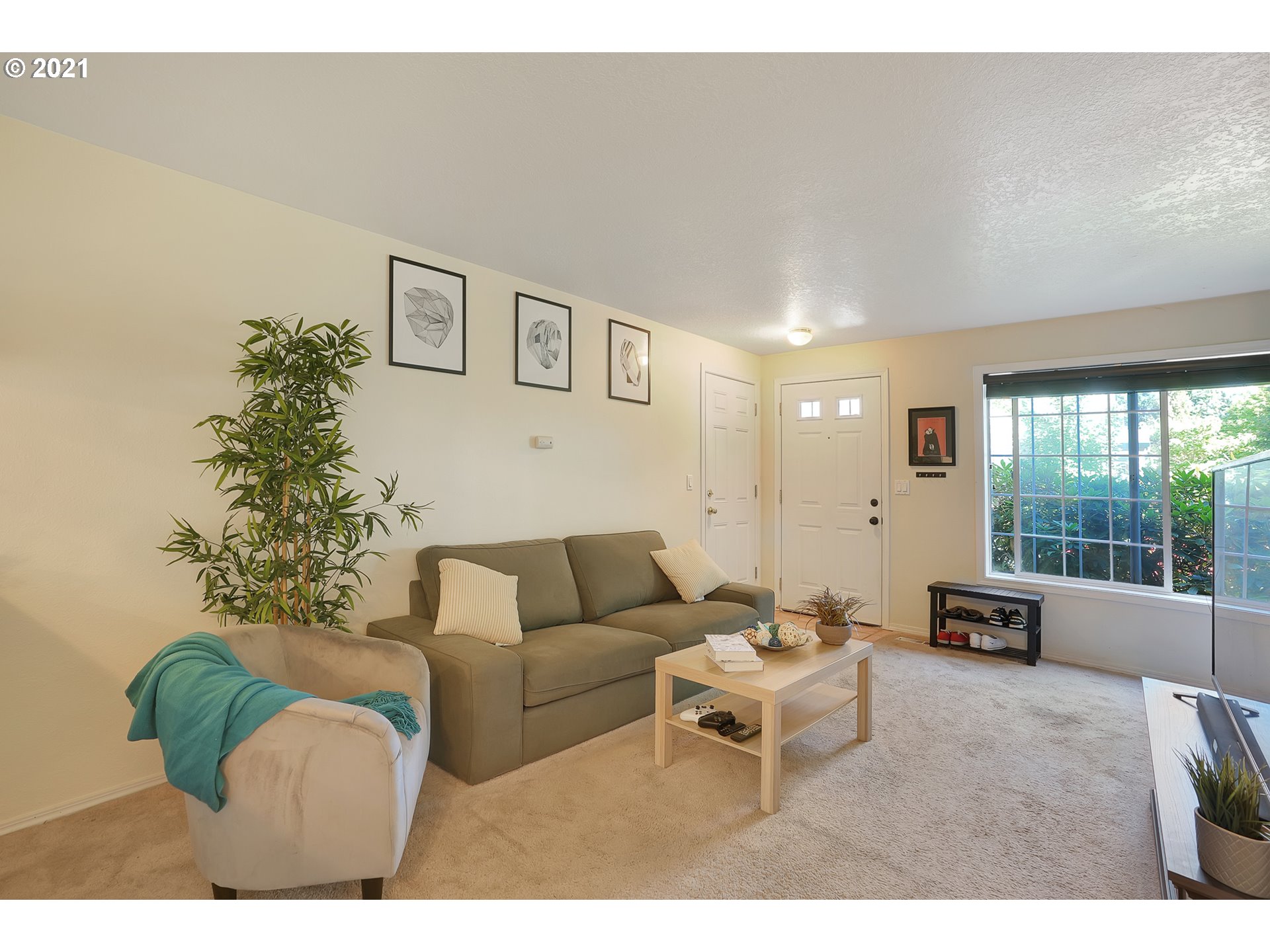 12648 Southeast Foster Road, Unit 10B Portland, OR 97236 - Photo 5 of 22 a living room with furniture and a large window