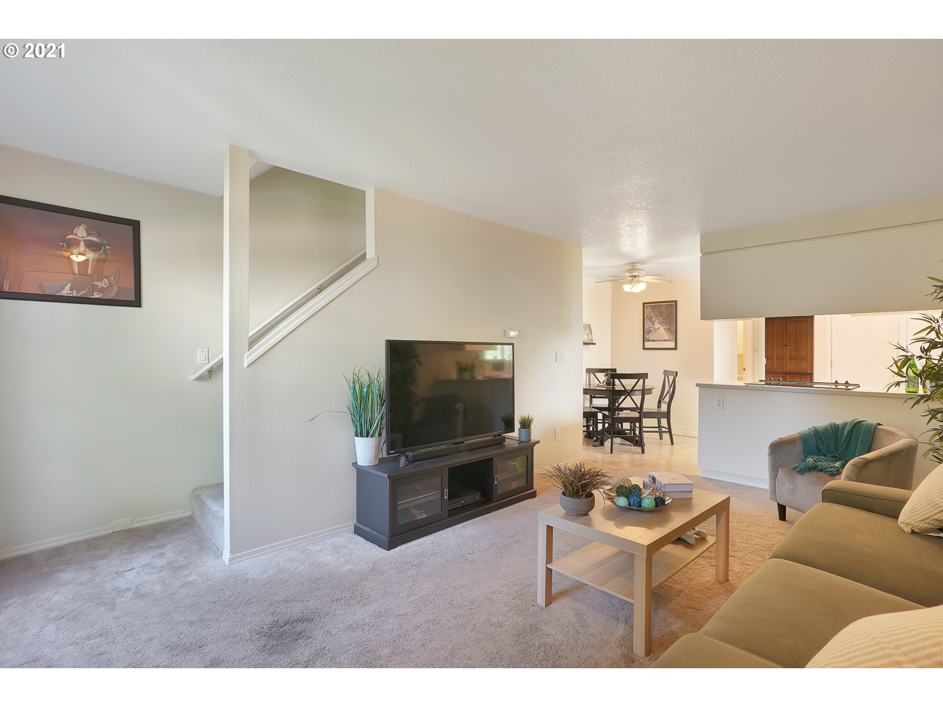 12648 Southeast Foster Road, Unit 10B Portland, OR 97236 - Photo 6 of 22 a living room with furniture and a flat screen tv