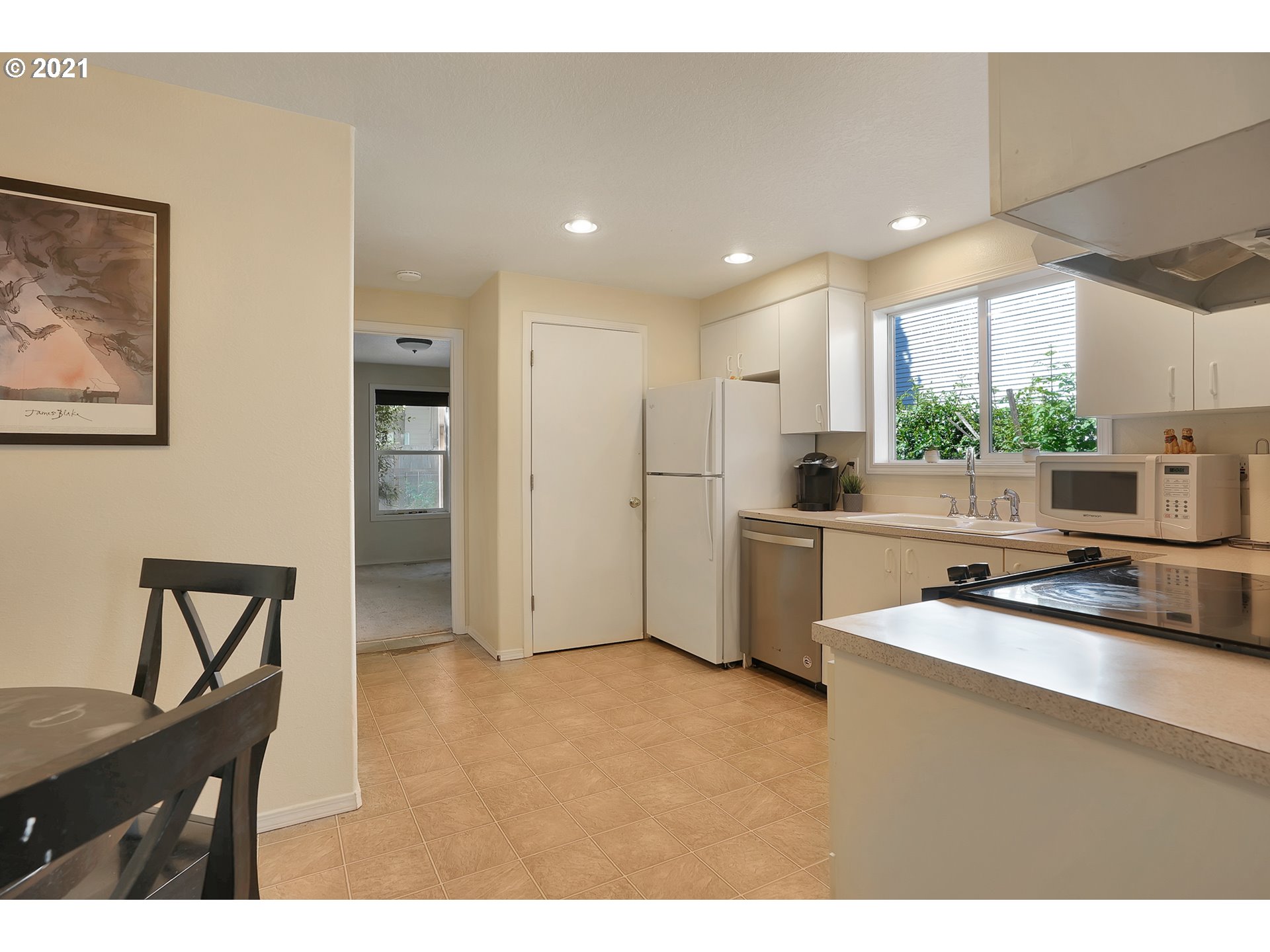 12648 Southeast Foster Road, Unit 10B Portland, OR 97236 - Photo 7 of 22 a kitchen with a sink cabinets and window