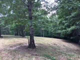 6 North Highland Road, Unit 6 Mill Spring, NC 28756 - Photo 4 of 6 a view of a yard with a tree