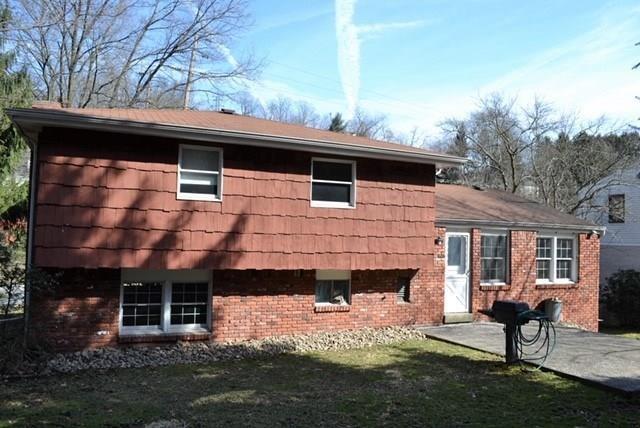 2108 Beulah Road Pittsburgh, PA 15235 - Photo 2 of 25 EXTERIOR REAR: The level backyard features a generous patio with a connected gas grill! Perfect for dining and entertaining!