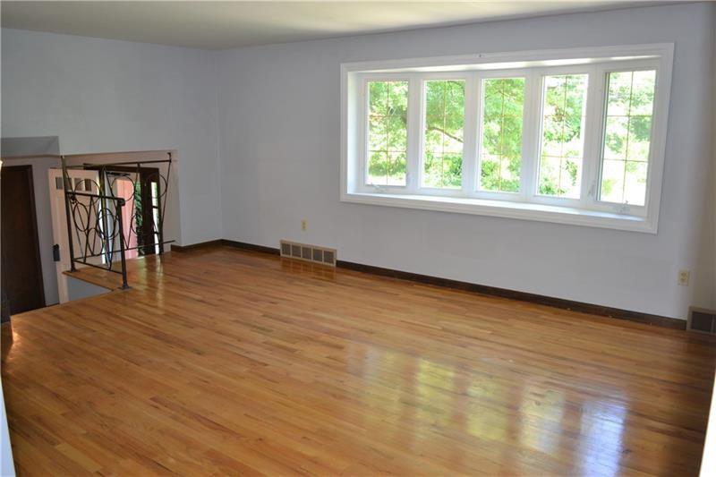 2108 Beulah Road Pittsburgh, PA 15235 - Photo 9 of 25 LIVING ROOM: The large living room features recently refinished BEAUTIFUL ORIGINAL NATURAL HARDWOOD FLOORING....