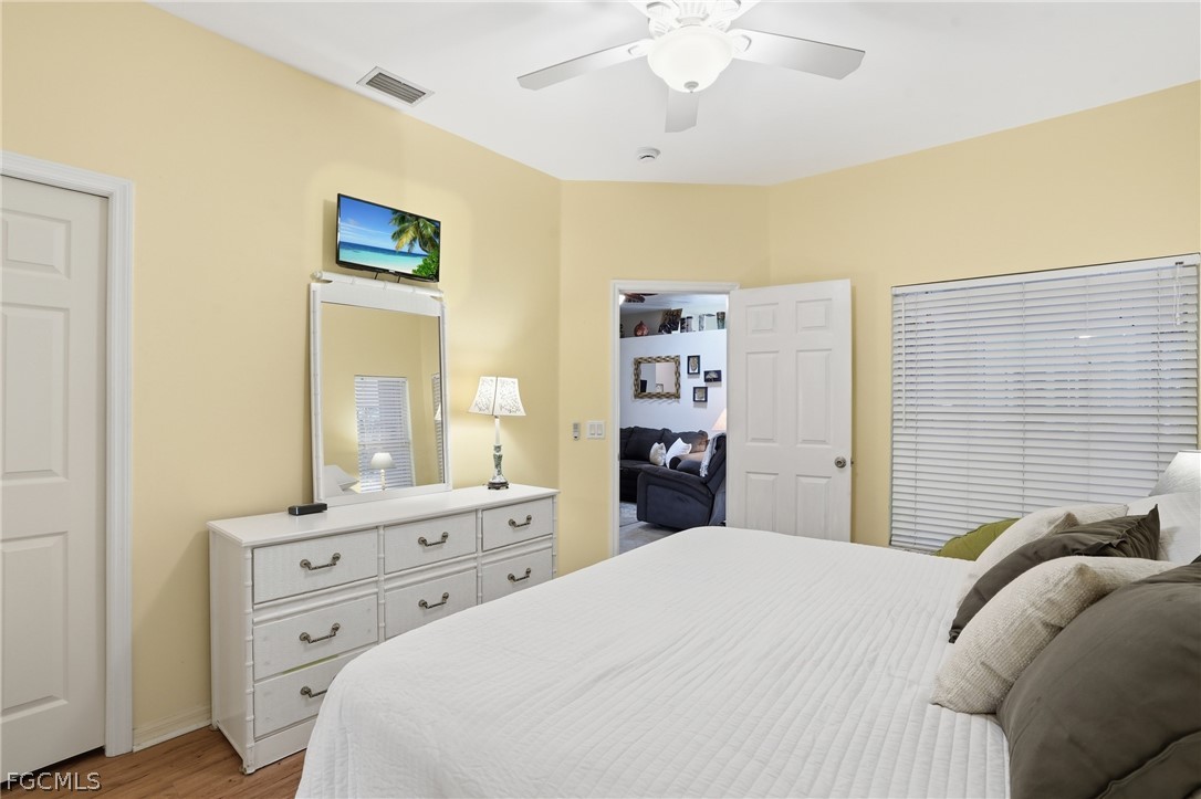 10730 Rio Mar Circle Estero, FL 33928 - Photo 17 of 47 a bedroom with a bed and a dresser