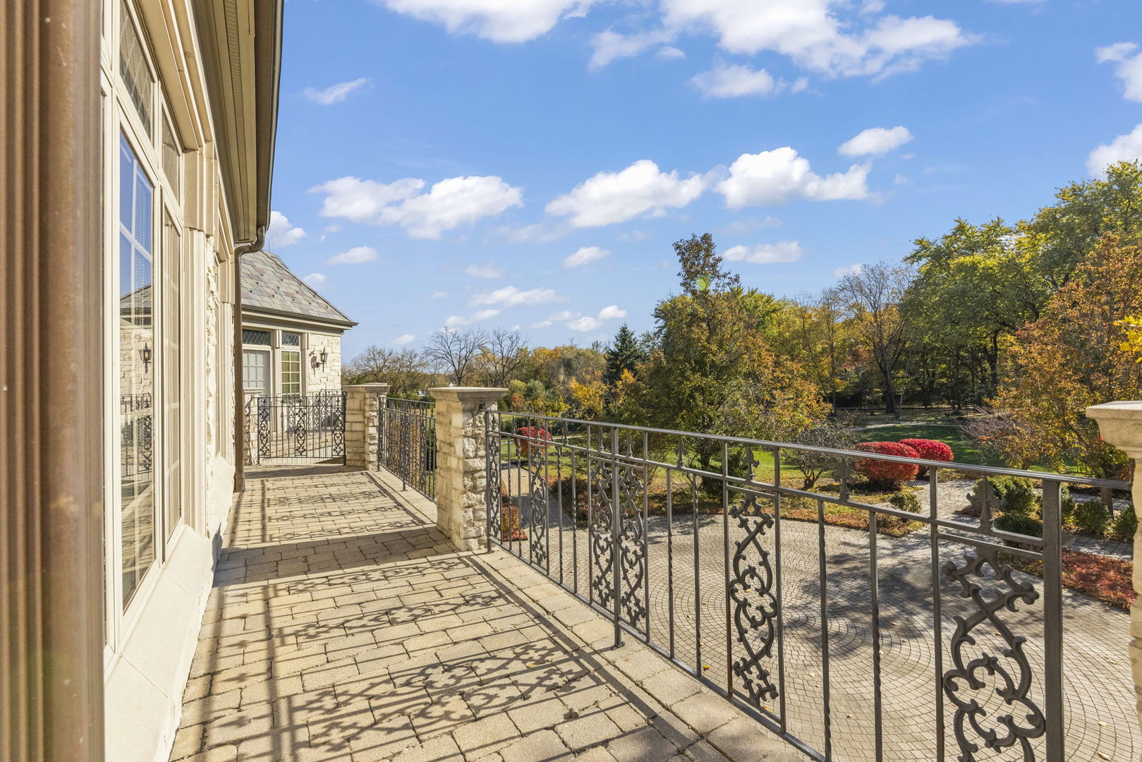 24W141 Hobson Road Naperville, IL 60540 - Photo 51 of 70 a view of a balcony with wooden floor and city view