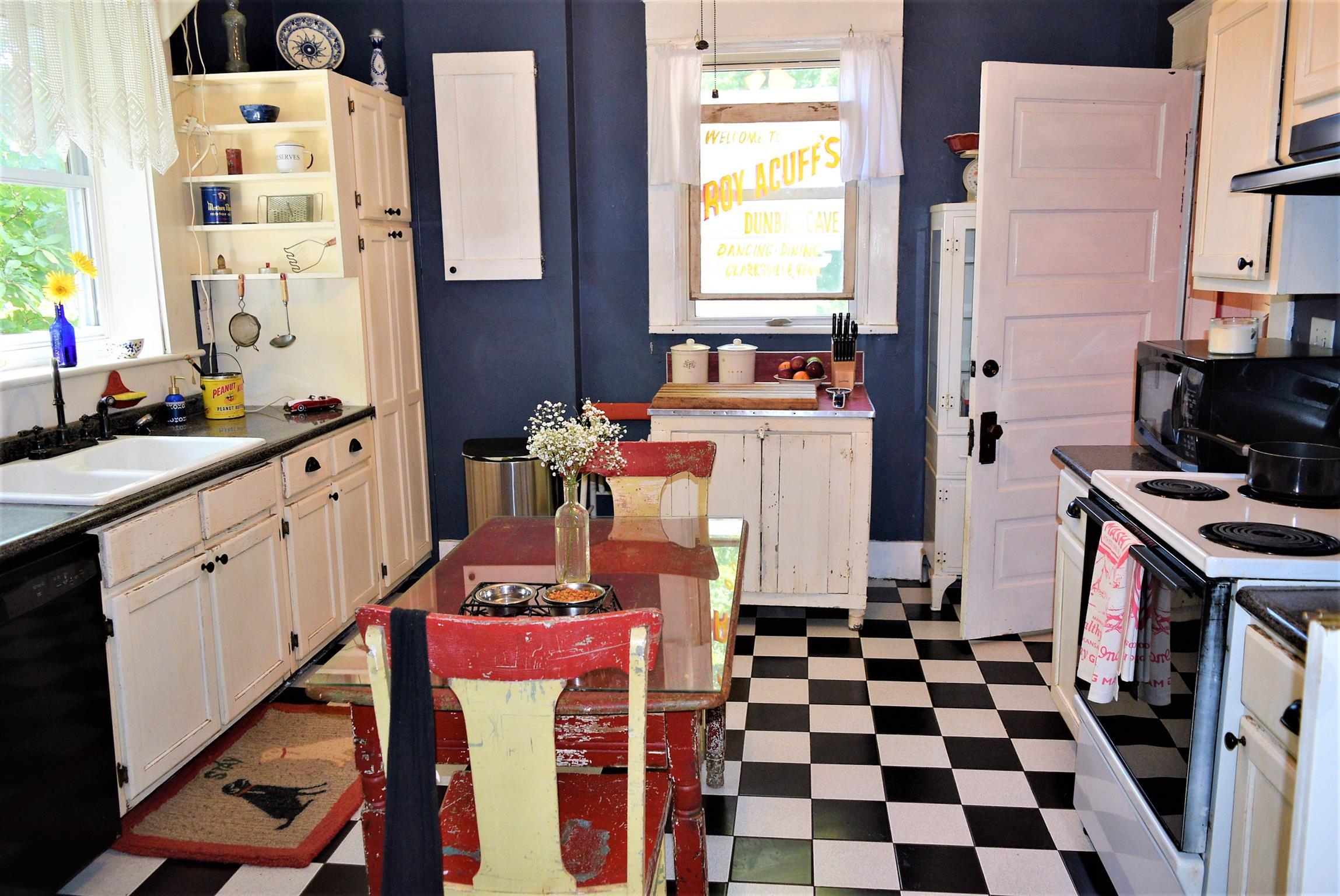 425 Spring Street Guthrie, KY 42234 - Photo 17 of 30 a room with a stove a sink and a window