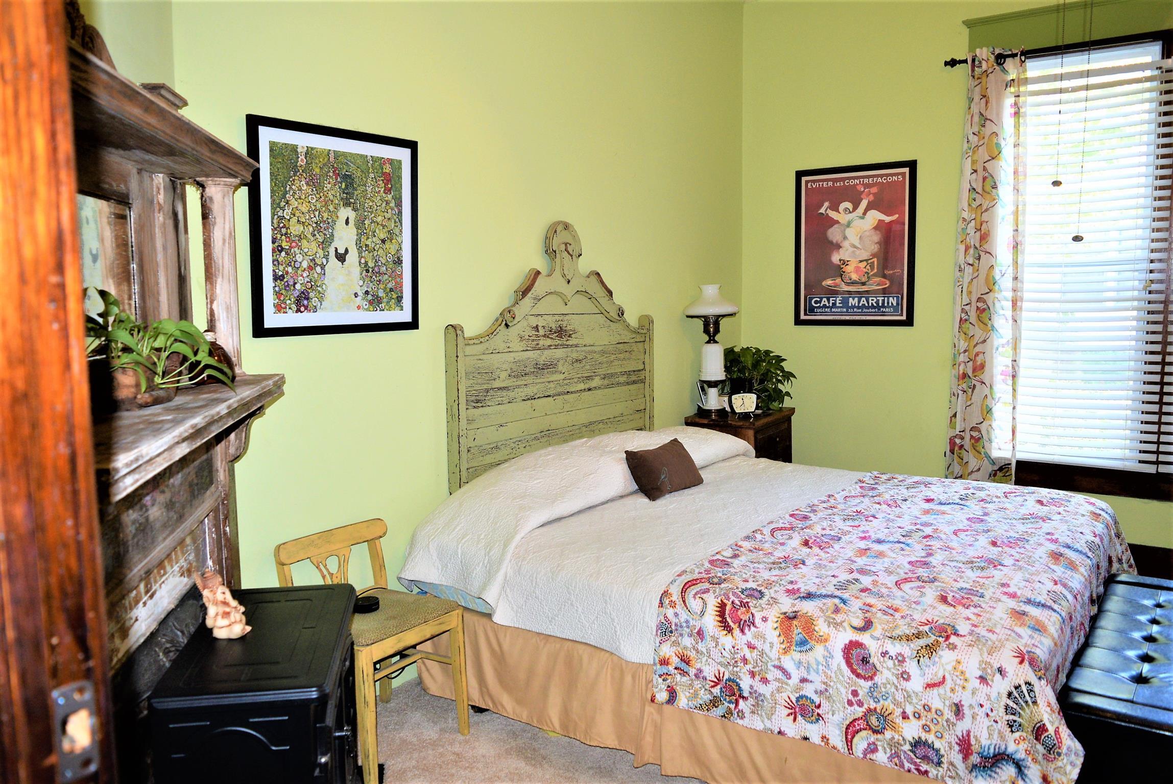 425 Spring Street Guthrie, KY 42234 - Photo 22 of 30 a bedroom with a bed and wooden floor