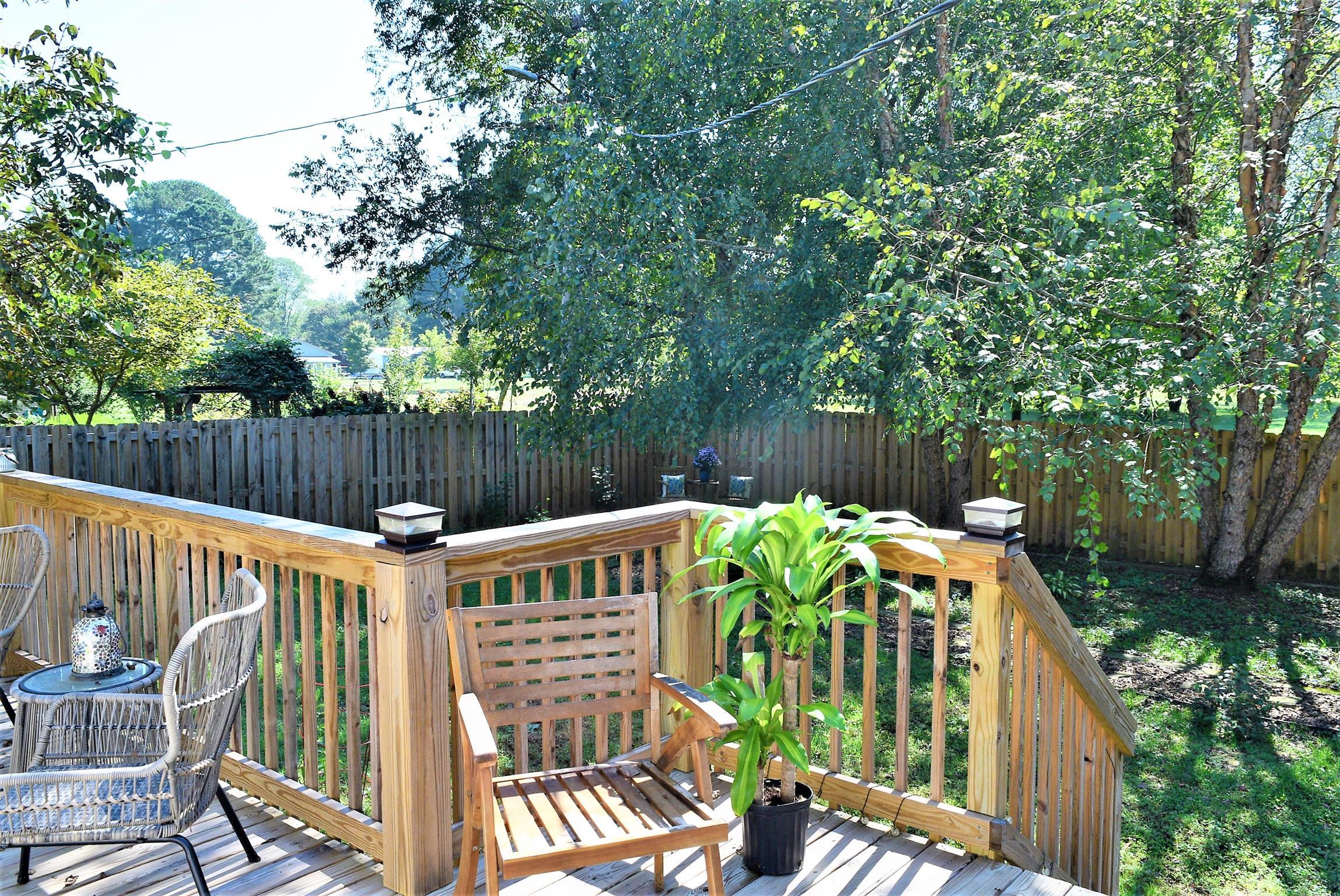 425 Spring Street Guthrie, KY 42234 - Photo 27 of 30 a view of a deck with furniture and trees