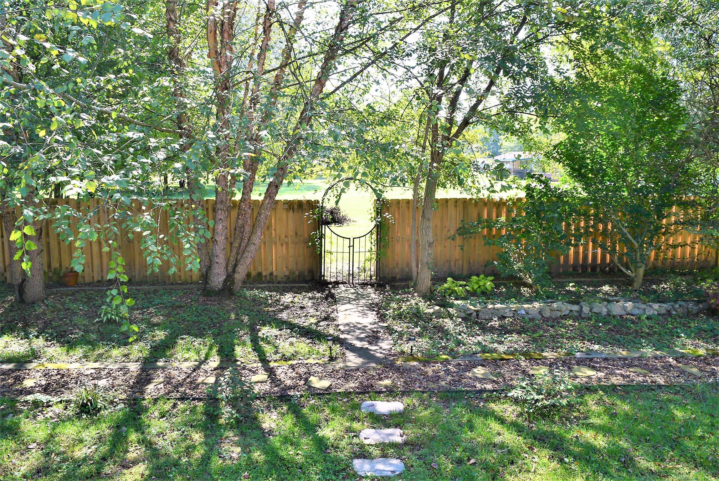 425 Spring Street Guthrie, KY 42234 - Photo 29 of 30 a backyard of a house with lots of green space