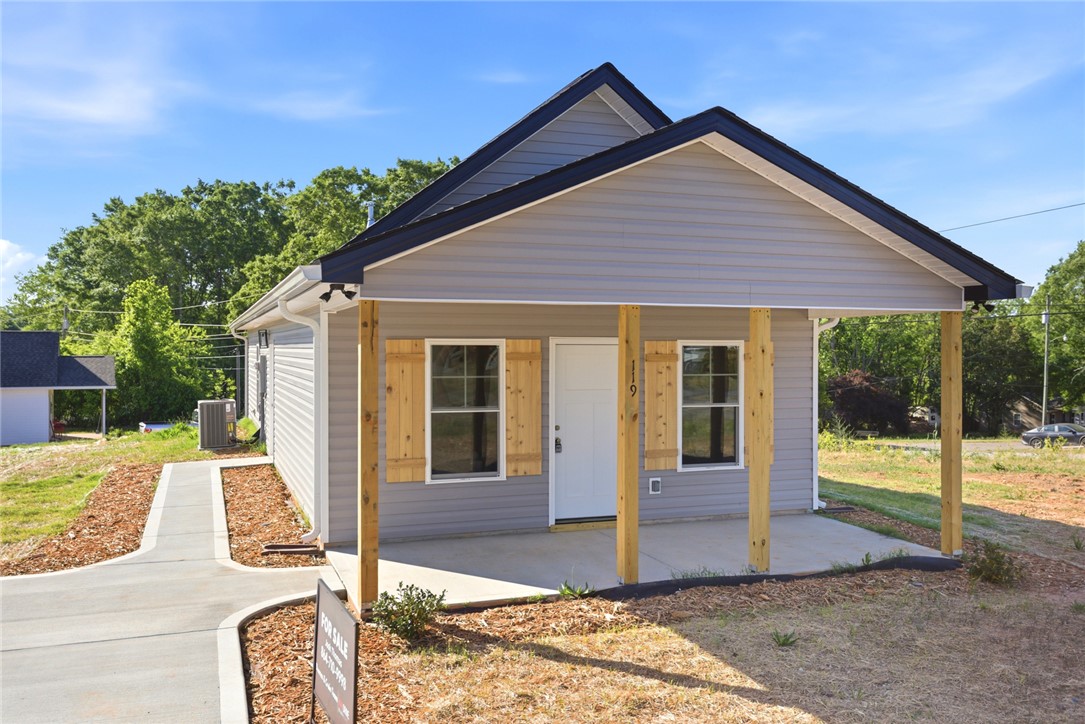 119 Riley Street Westminster, SC 29693 - Photo 1 of 44 This charming home offers a welcoming facade with a cozy porch, perfect for enjoying quiet mornings.