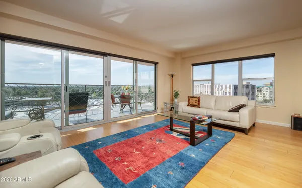 a living room with furniture and a large window