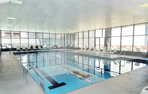 a dining room with a table and chairs