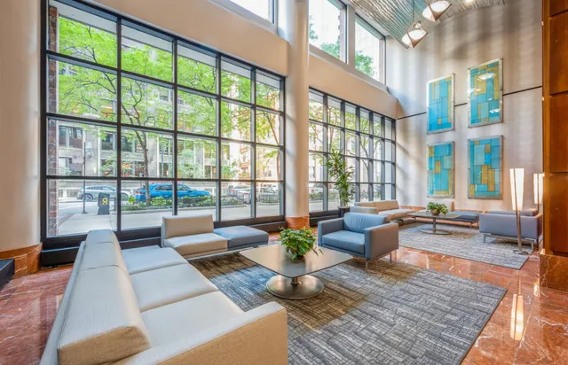 a living room with furniture and a large window