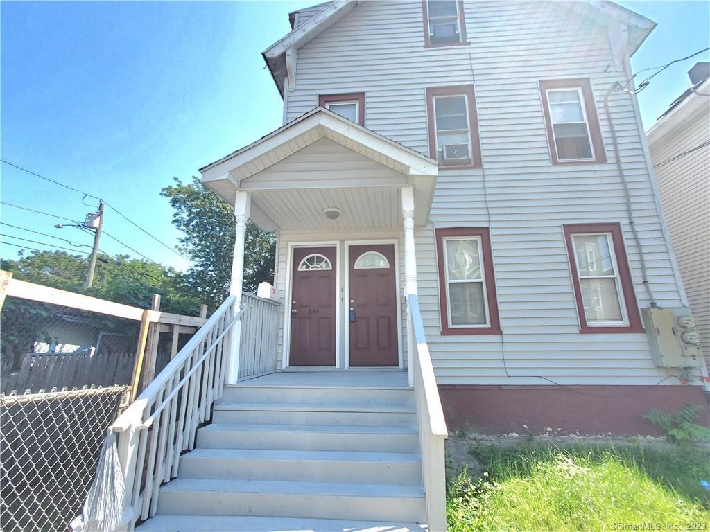 a front view of a house with stairs