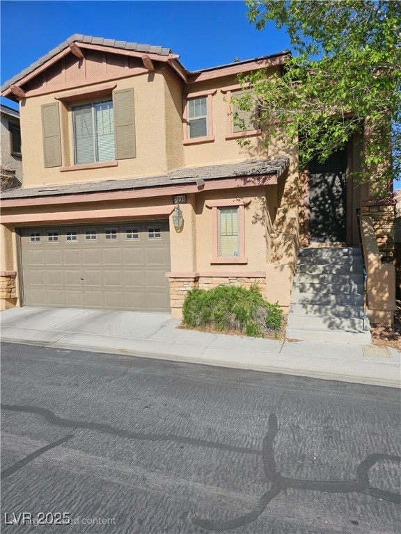 View of front of property with stone siding, stucco siding, and a garage