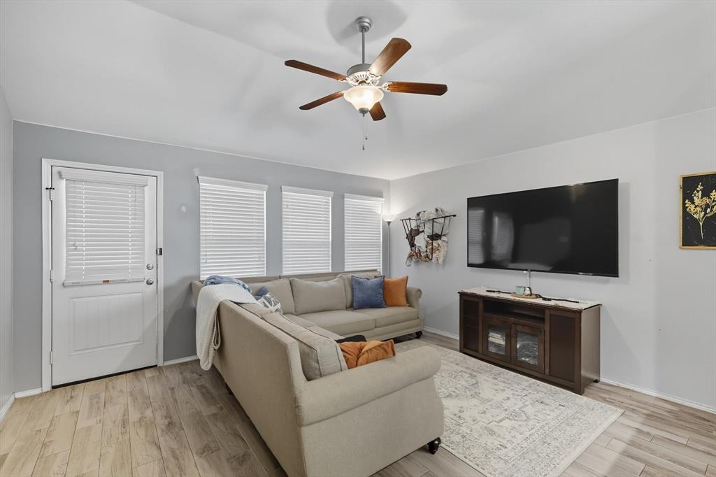 14564 Serrano Ridge Road Fort Worth, TX 76052 - Photo 11 of 29 a living room with furniture and a flat screen tv