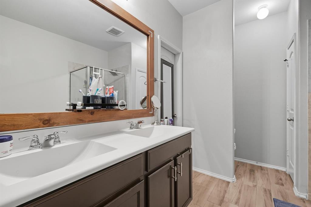 14564 Serrano Ridge Road Fort Worth, TX 76052 - Photo 16 of 29 a bathroom with a sink and a mirror