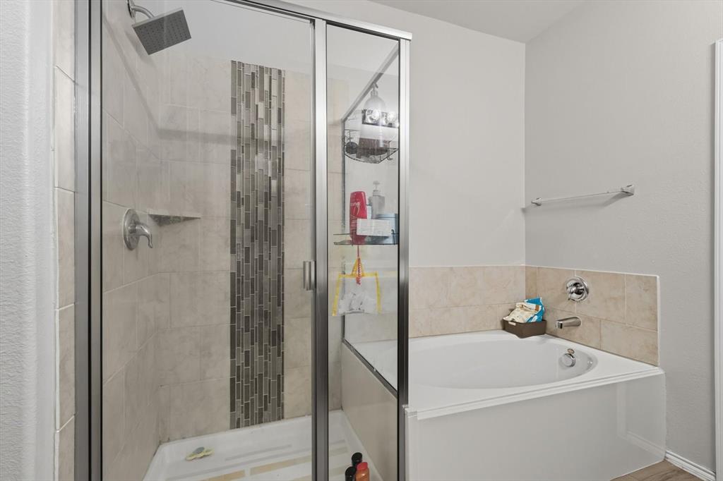 14564 Serrano Ridge Road Fort Worth, TX 76052 - Photo 17 of 29 a bathroom with a bathtub and a shower